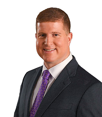 Portrait of Drew Fellios, REALTOR®.